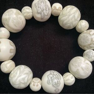 LAST CH ANCE CLEARANCE HOWLITE BRACLET WITH GRAVED SYMBOLS. CLASSY & STYLISH.